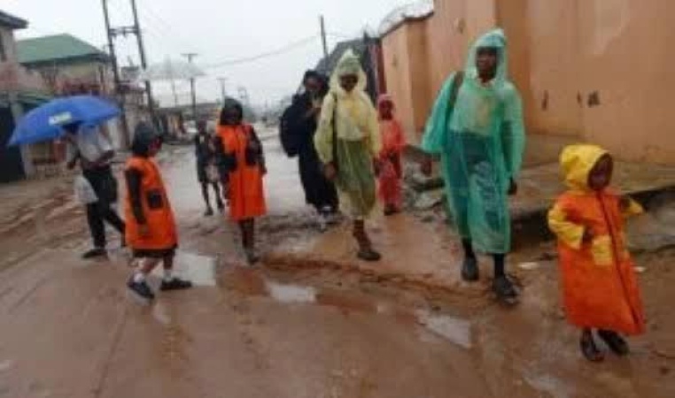Nylon Raincoats Replace Umbrellas for Lagos Commuters